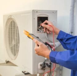 AC-Technician-checking-air-conditioning-system
