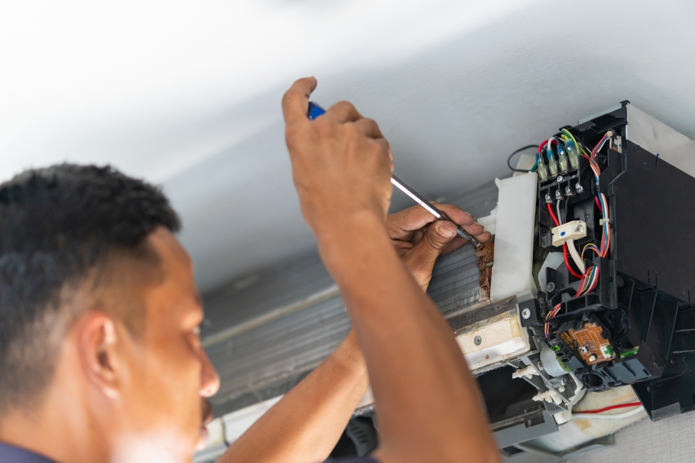 Repairman fixes ac